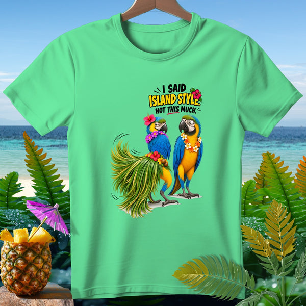 Two macaws on a beach scene with text "I SAID ISLAND STYLE NOT THIS MUCH".