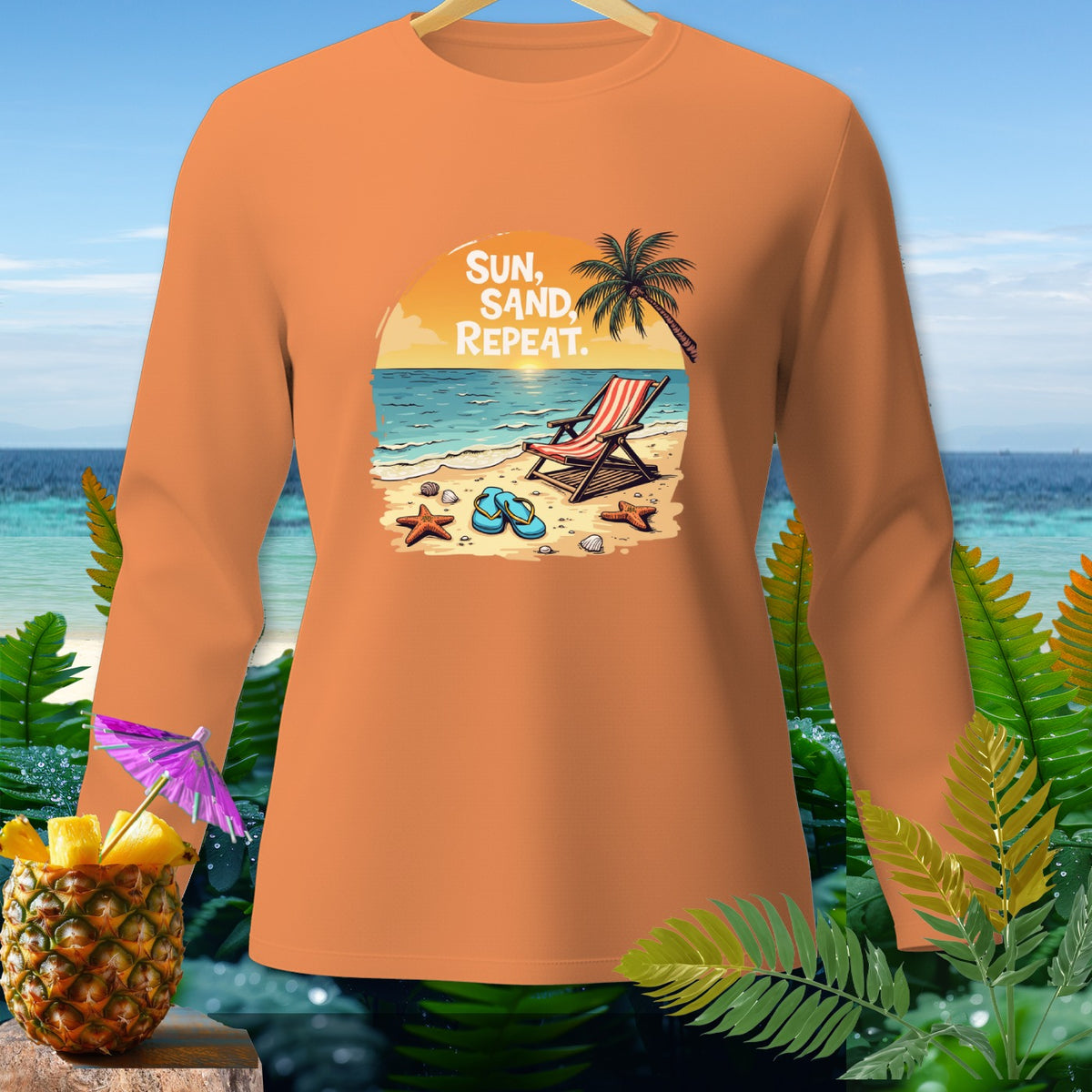 Orange long-sleeve shirt with beach graphic and text "SUN, SAND, REPEAT."