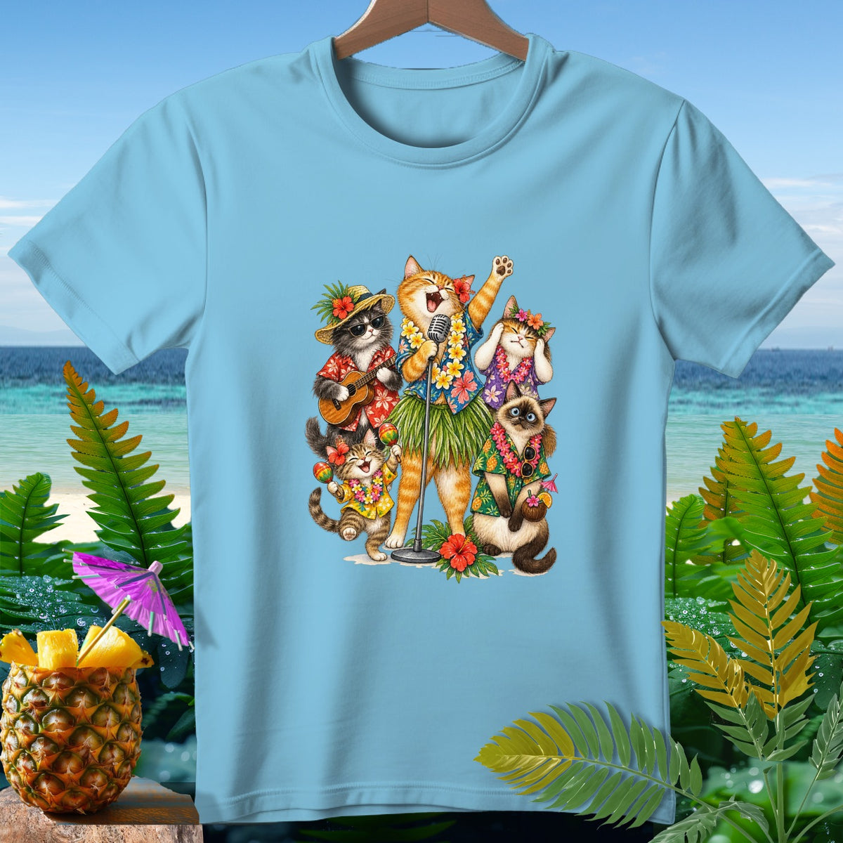 Five cats in Hawaiian attire sing and play instruments on a beach.