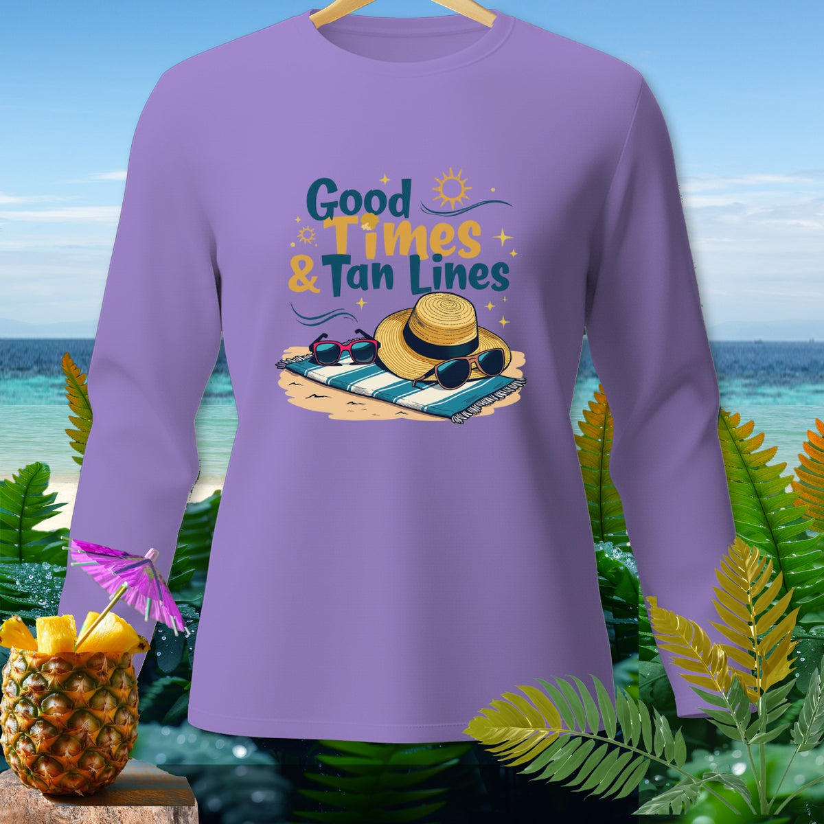 Purple long sleeve shirt with "Good Times & Tan Lines" text and beach accessories.