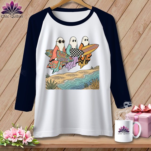 Ghosts with surfboards, one labeled "BOO CREW", on a beach.