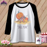 Hermit crab with jack-o'-lantern and candy corn. 