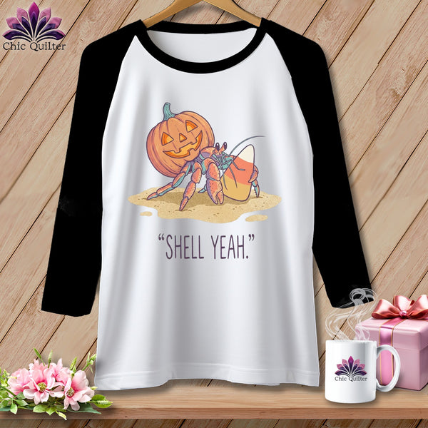 Hermit crab with jack-o'-lantern and candy corn. "Shell Yeah."