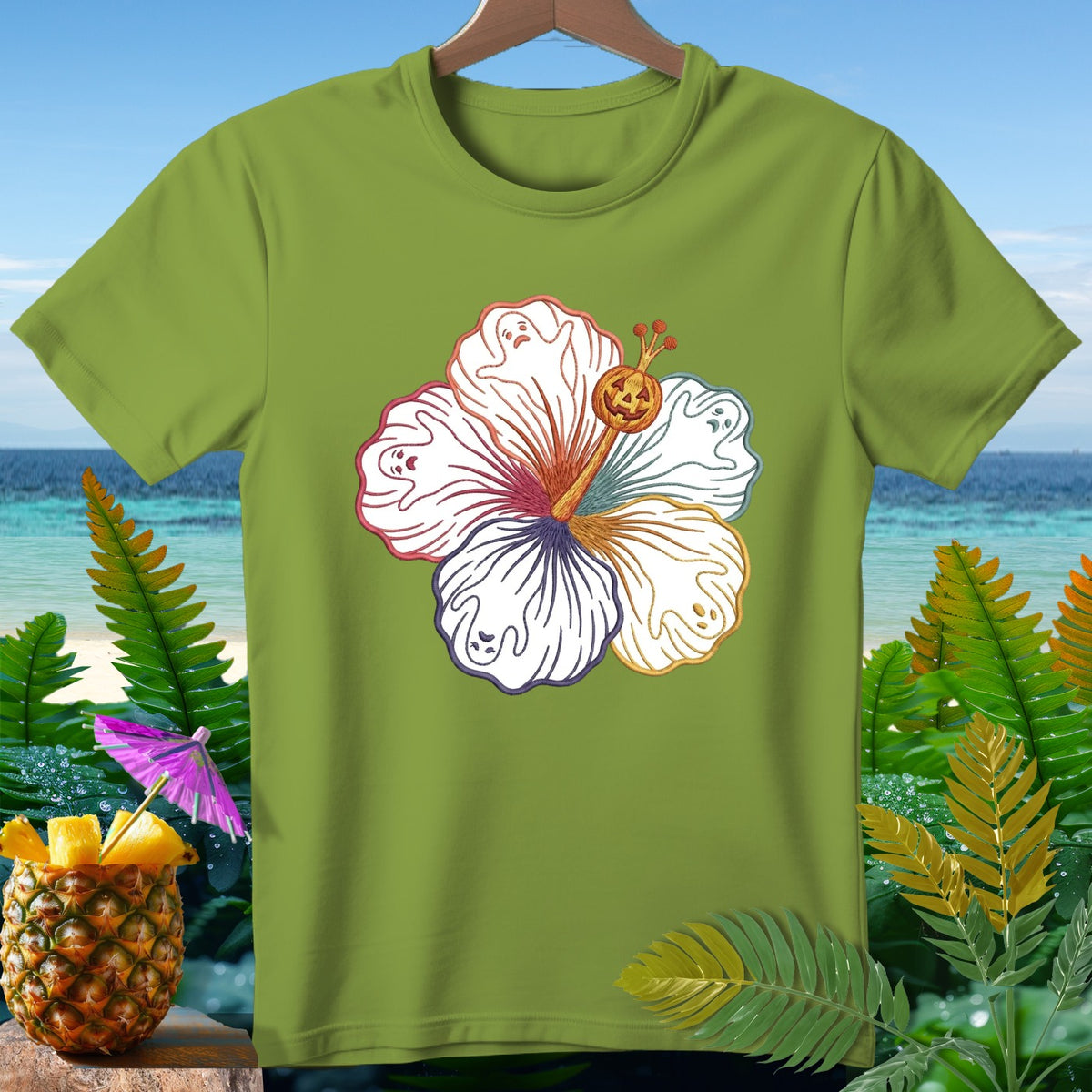 Light green t-shirt with a white hibiscus flower design featuring ghosts and a jack-o'-lantern.
