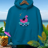 Teal hoodie with a black cat wearing a party hat on a pink flamingo float.