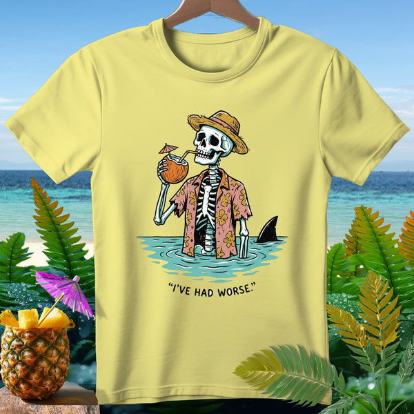 Skeleton in Hawaiian shirt drinks coconut, shark fin visible, with text "I'VE HAD WORSE."