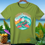Green t-shirt with a turtle, ghost, and surfboard graphic with 