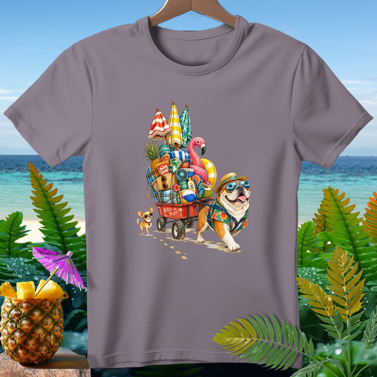 Bulldog and chihuahua pulling a wagon full of beach items with text "Beach or Bust!"