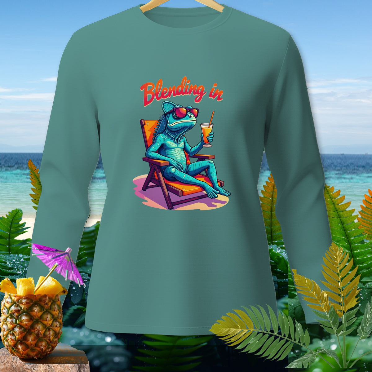 Teal long-sleeve shirt with a blue lizard wearing sunglasses and drinking a cocktail.