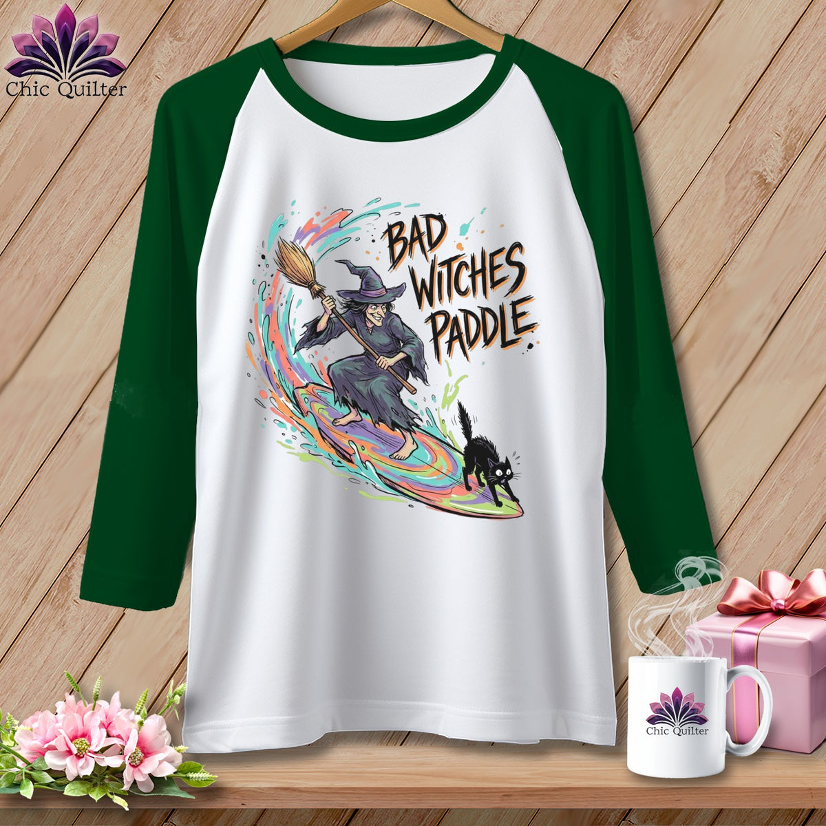 White raglan shirt with "Bad Witches Paddle" text, witch, and cat graphic.