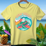 Yellow t-shirt with cartoon turtle and ghost surfing a wave, saying 