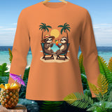 Long sleeve orange shirt with a graphic of two sloths relaxing on a beach with palm trees and cocktails.
