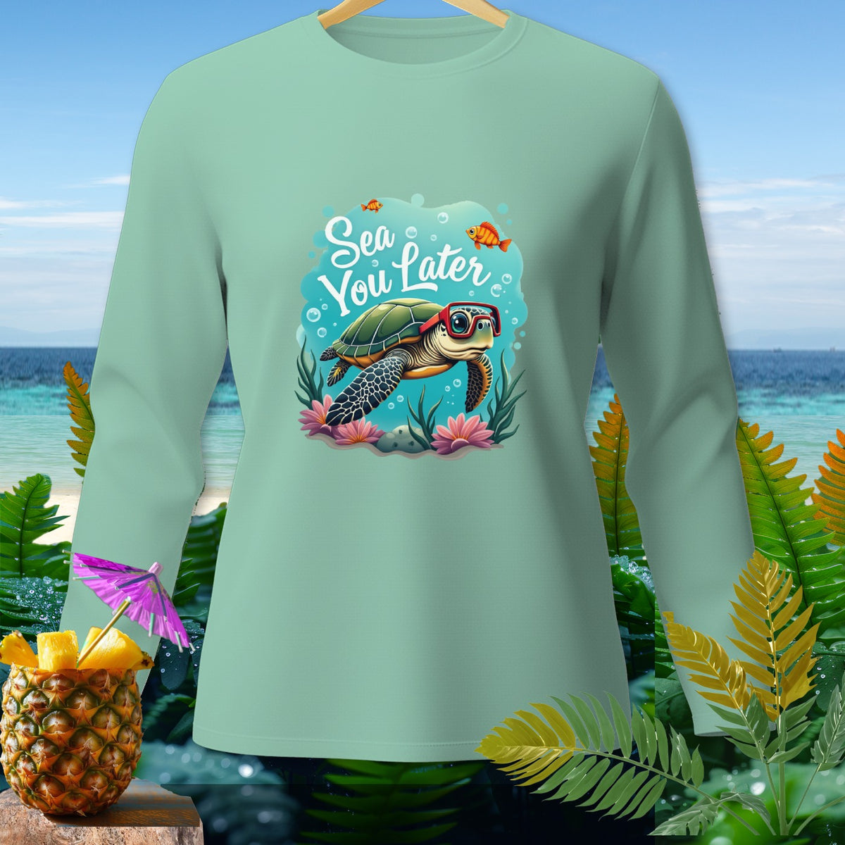 Light green long-sleeve shirt with a sea turtle wearing glasses and text "Sea You Later".