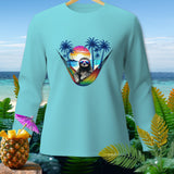 Light blue long-sleeve shirt with a sloth wearing sunglasses in a rainbow hammock.