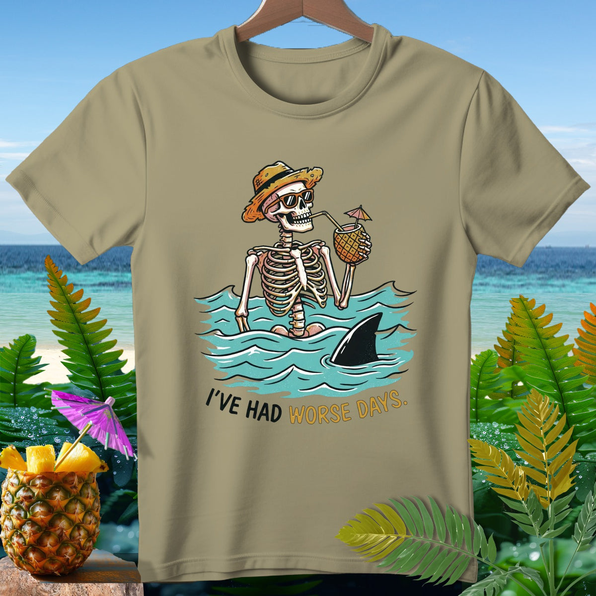 Skeleton in the ocean with shark fin and text "I'VE HAD WORSE DAYS."