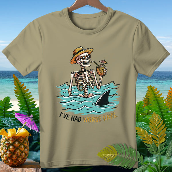 Skeleton in the ocean with shark fin and text "I'VE HAD WORSE DAYS."