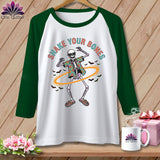Green sleeve shirt with dancing skeleton graphic and text 