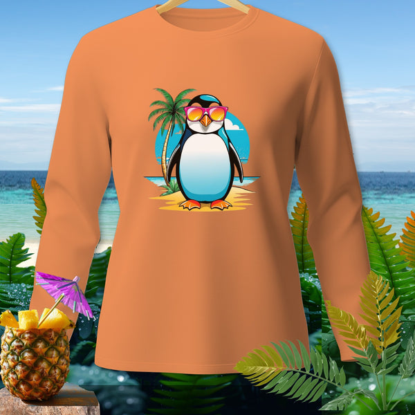 Long sleeve orange shirt with a cartoon penguin wearing sunglasses on a beach.