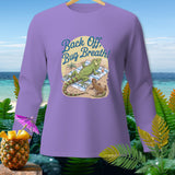 Long-sleeve shirt with cartoon iguanas on a beach with text 