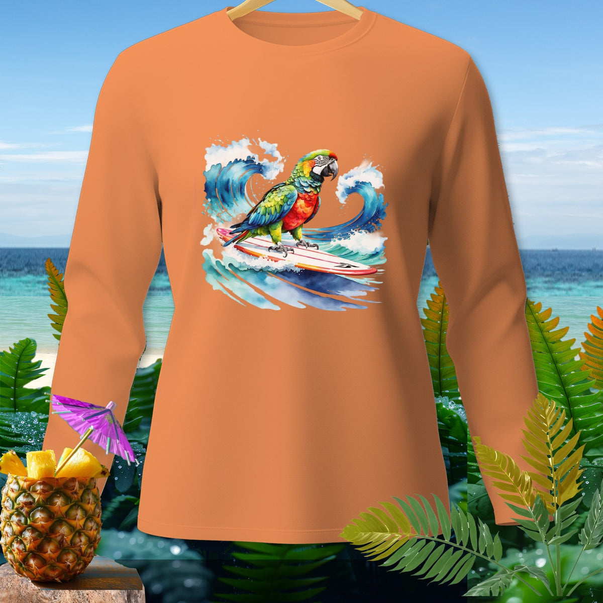 Orange long-sleeve shirt with a surfing parrot graphic and tropical background.