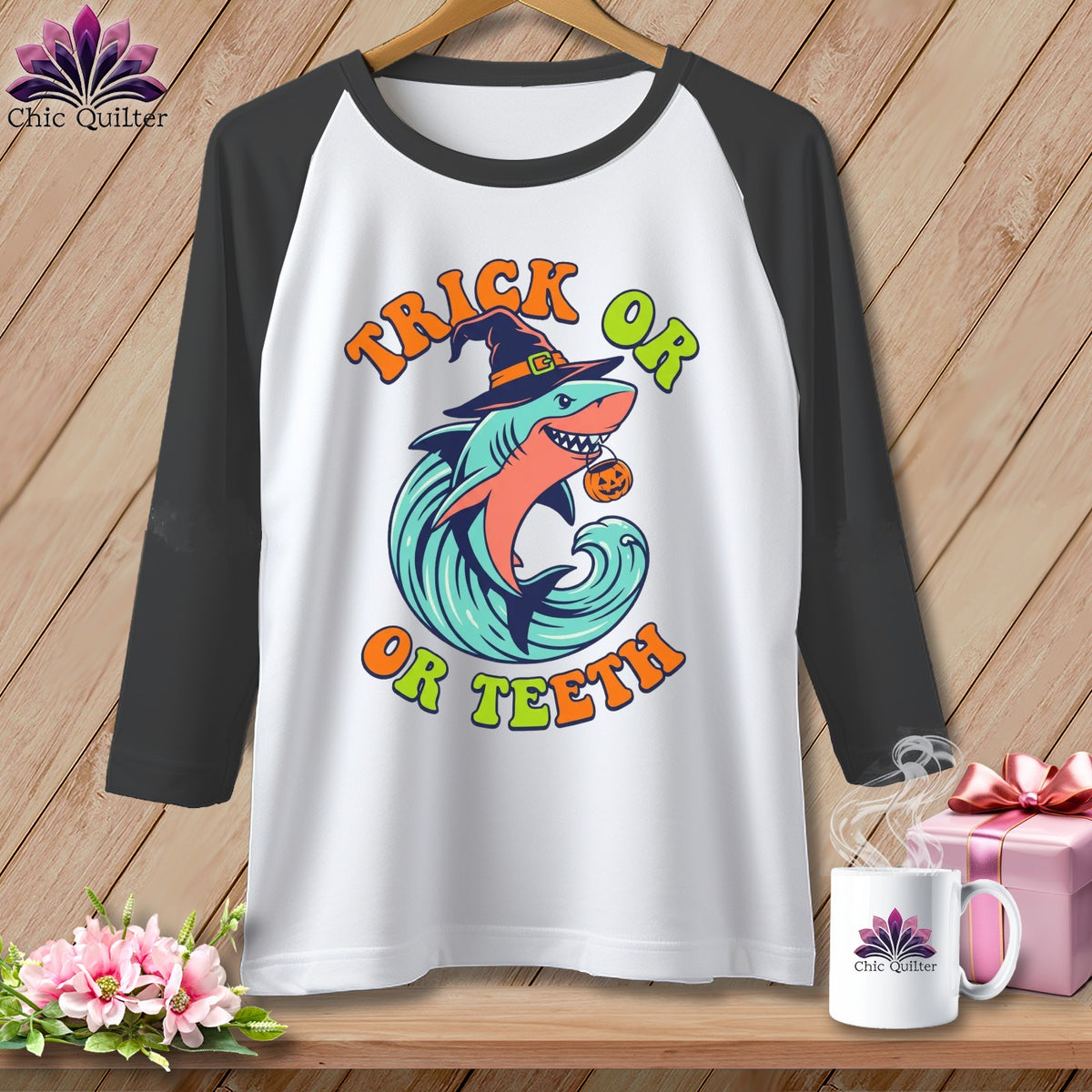 Raglan shirt with Halloween shark graphic saying "Trick or Teeth".
