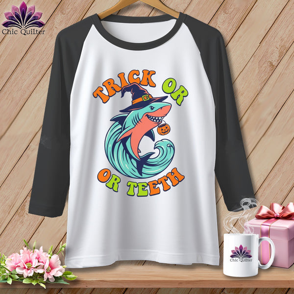 Raglan shirt with Halloween shark graphic saying "Trick or Teeth".