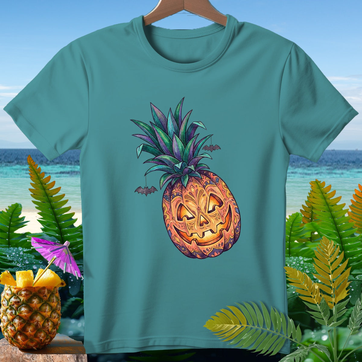 Teal t-shirt with jack-o-lantern pineapple Halloween design and hanging bats.