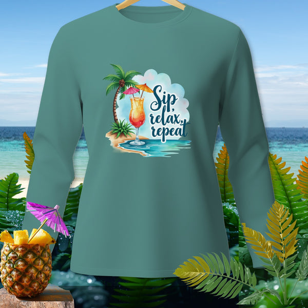 Teal long sleeve shirt with tropical drink and "Sip relax repeat" text.