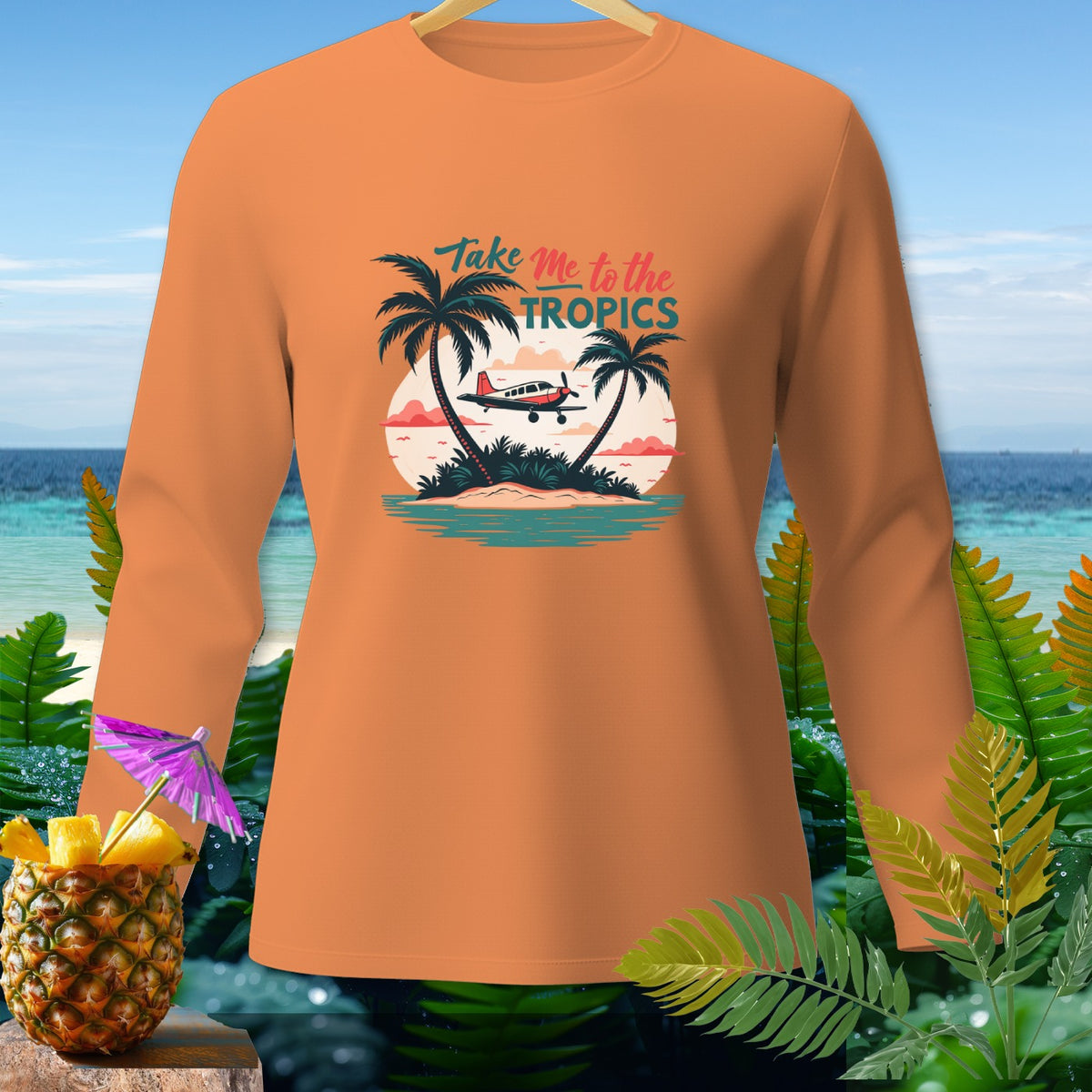 Orange long-sleeve shirt with "Take Me to the Tropics" text and island graphic.