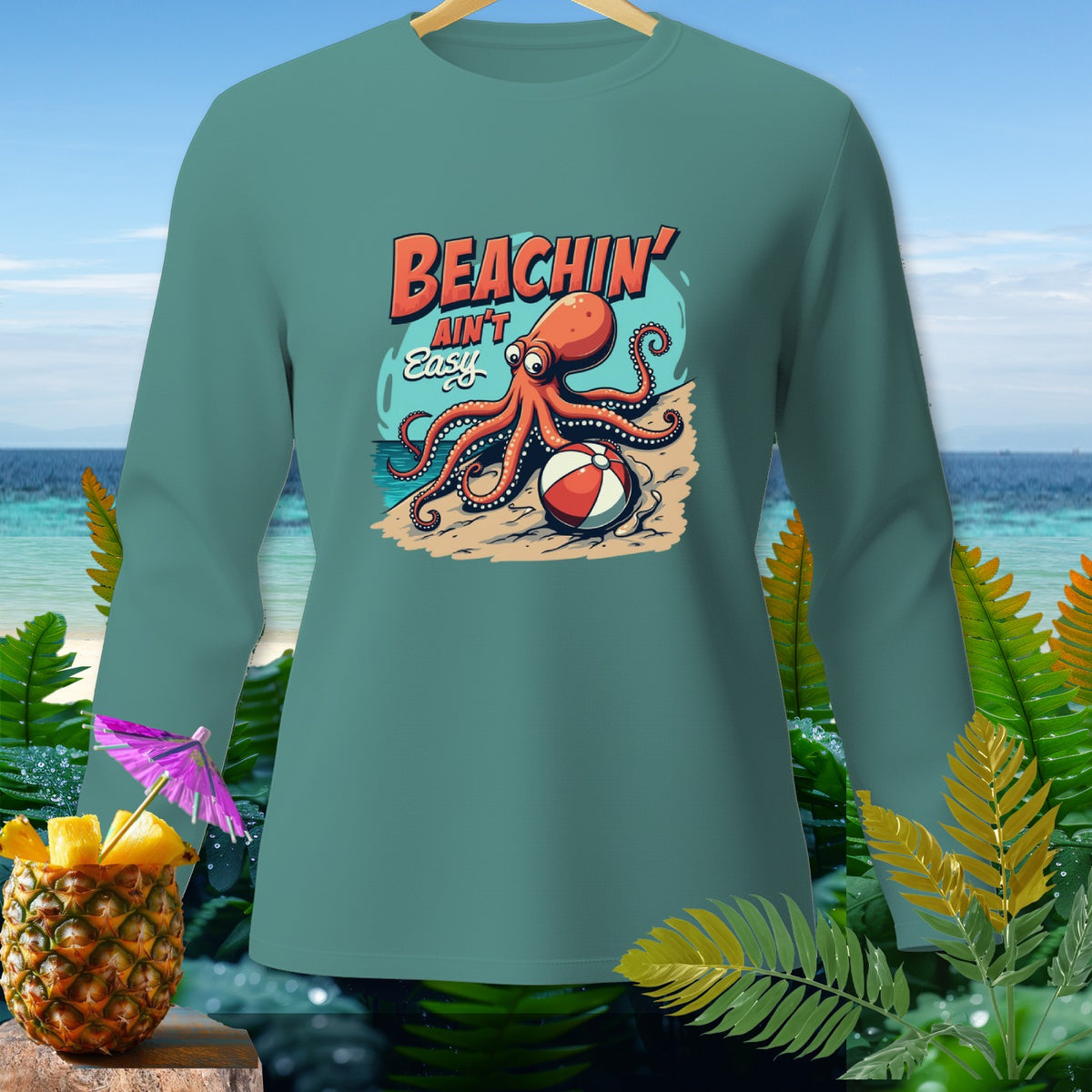 Teal long-sleeve shirt with octopus graphic reading "BEACHIN' AIN'T Easy".