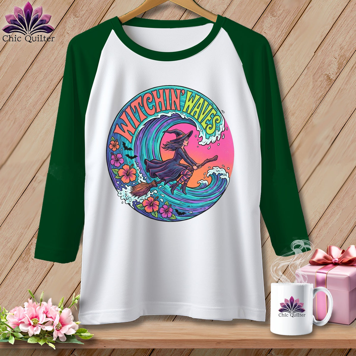 White baseball tee with "Witchin' Waves" graphic of a witch on a broom over a wave.