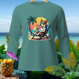 Teal long-sleeve shirt with cartoon dog in sunglasses relaxing on beach.