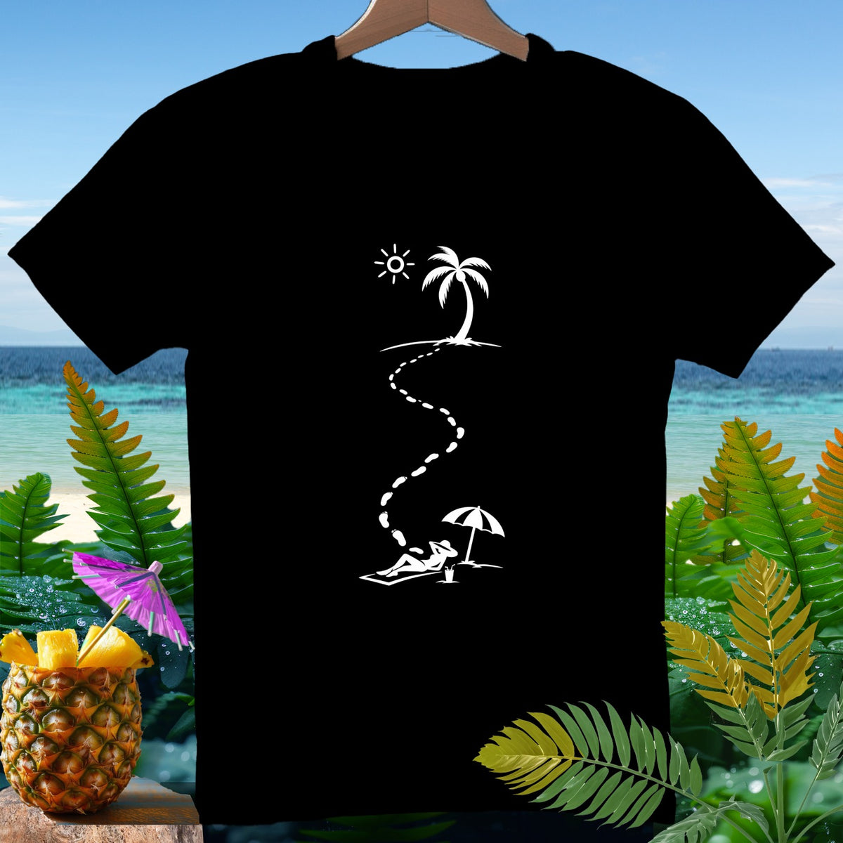 Black t-shirt with white graphic of footprints leading to person under umbrella on beach.