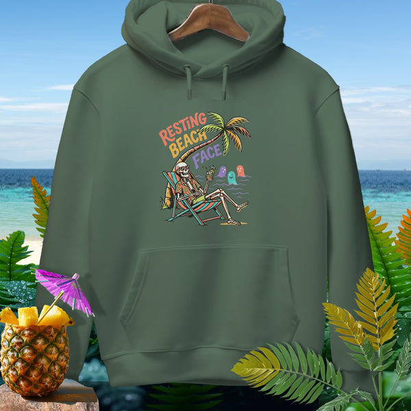 Green hoodie featuring a skeleton relaxing on a beach chair with "Resting Beach Face" text.