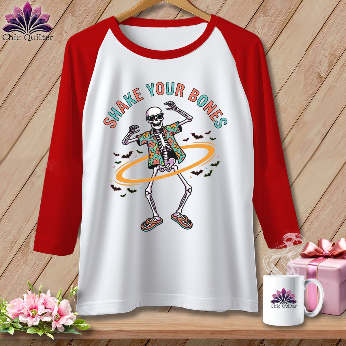 White raglan t-shirt with dancing skeleton graphic and text "Shake Your Bones".