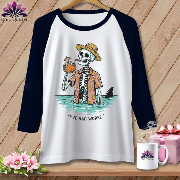 T-shirt with skeleton wearing straw hat and floral shirt, drinking coconut, with shark fin.