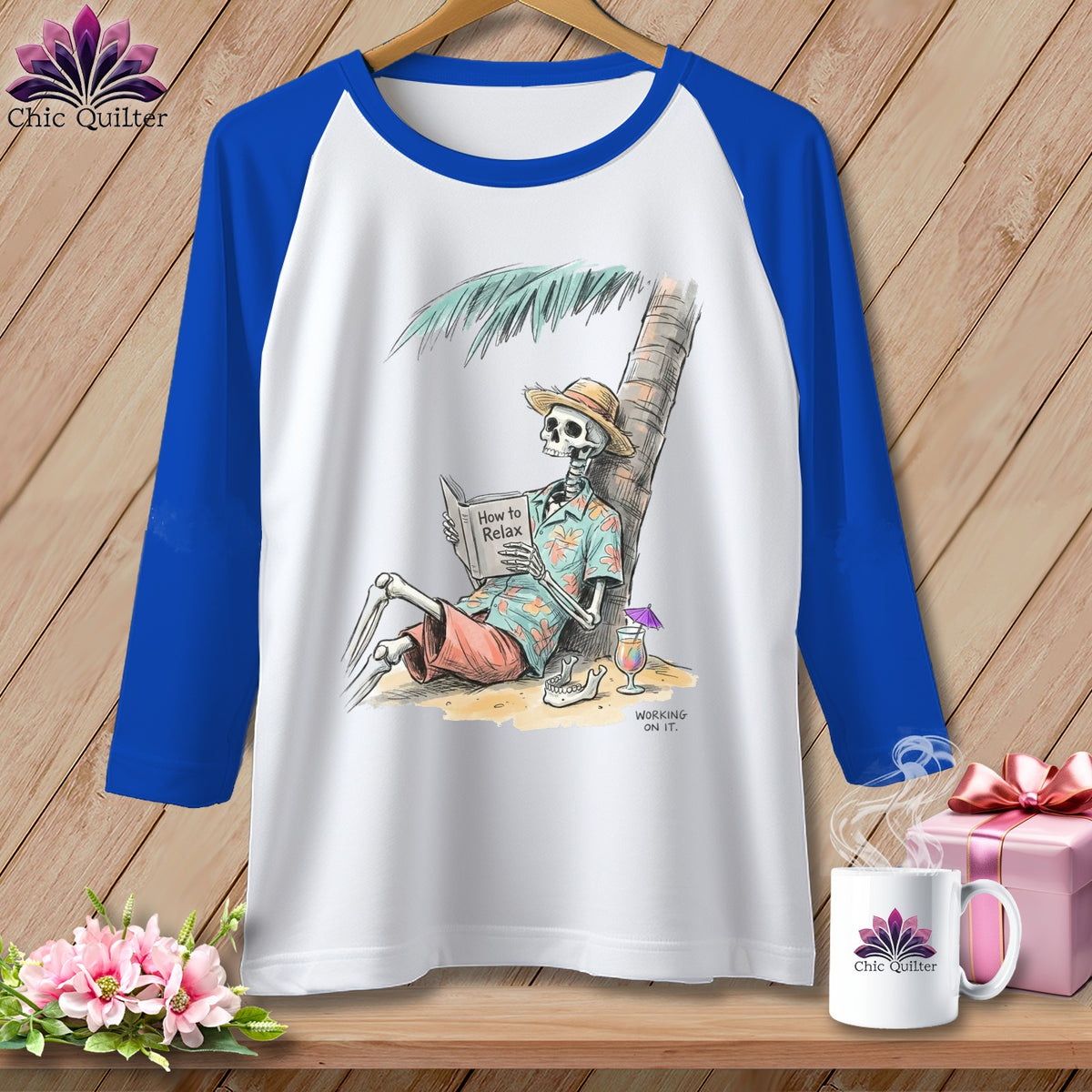 White t-shirt with royal blue sleeves, featuring a skeleton reading "How to Relax" under a palm tree.