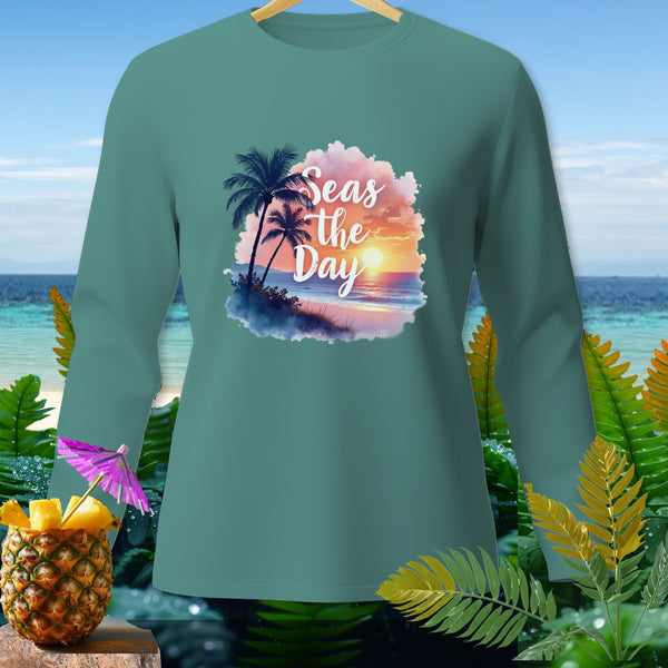 Teal long-sleeve shirt with "Seas the Day" beach sunset graphic.