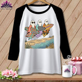 Three ghosts in robes carry surfboards on a beach with wavy water.