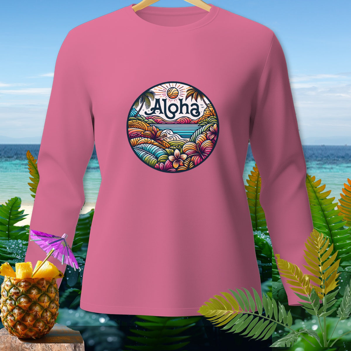 Pink long sleeve shirt with circular tropical graphic and "Aloha" text.