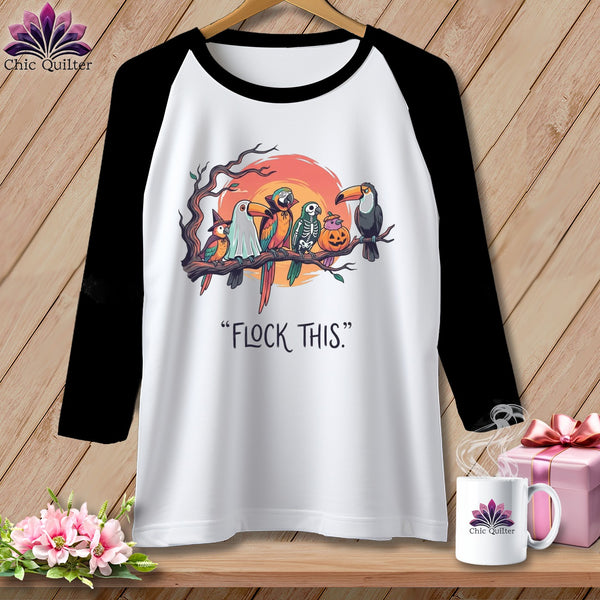 White baseball tee with Halloween-themed parrots and the text "FLOCK THIS."
