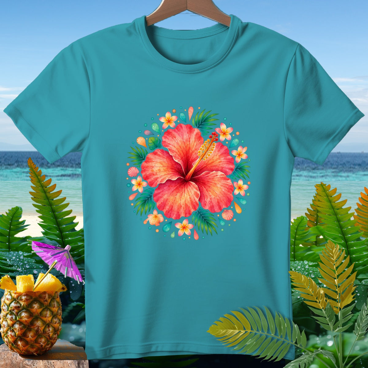 Teal t-shirt with a large red hibiscus flower surrounded by tropical leaves and small flowers.