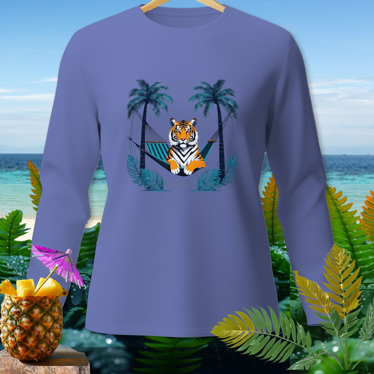Long sleeve shirt with a tiger lounging in a hammock between palm trees.