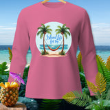 Pink long-sleeve shirt with a graphic of palm trees, hammock, and the text 