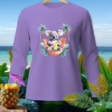 Purple long-sleeve shirt with a cartoon koala relaxing in a hammock with a drink.