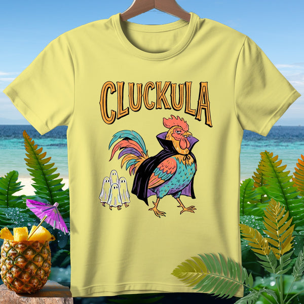 Yellow t-shirt with a cartoon rooster dressed as a vampire, with three ghosts and "CLUCKULA" text.