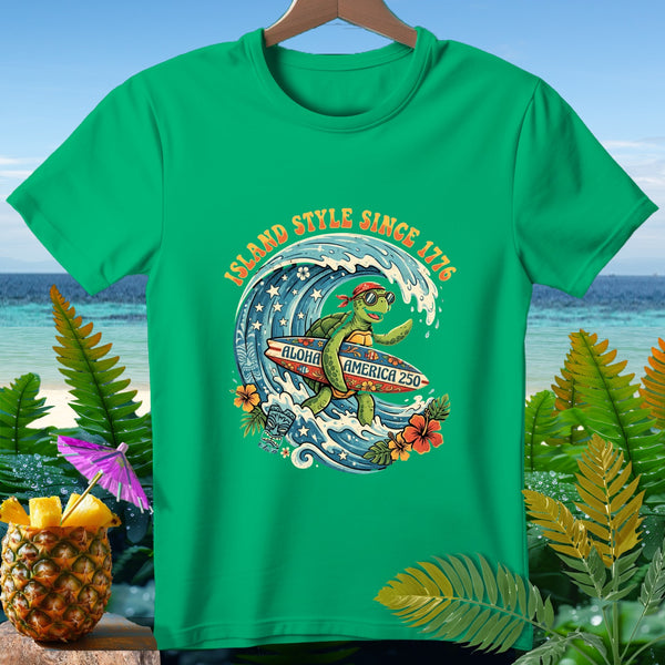 Green t-shirt with surfing turtle graphic, "Island Style Since 1776" and "Aloha America 250".