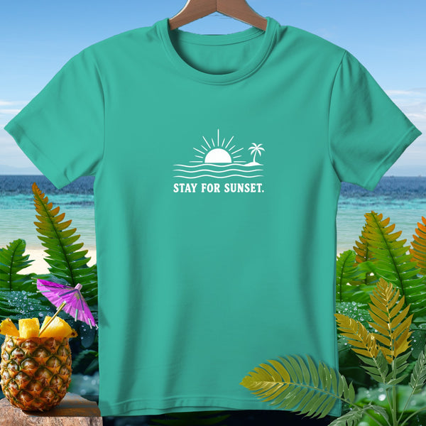 Teal t-shirt with white sunset, waves, palm tree graphic and "STAY FOR SUNSET." text.