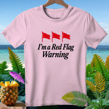 Pink t-shirt with red flags and text 