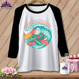 T-shirt graphic with a turtle riding a surfboard and ghost, text 